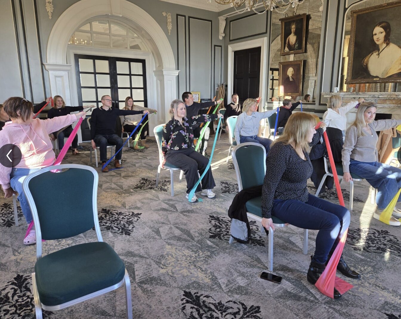 Corporate Chair Yoga Oulton Hall Yoga by Nadine Hill with resistance bands