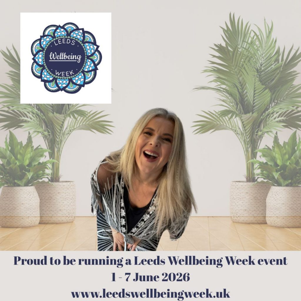 This is a photo of Nadine Hill, a white woman with blonde hair wearing a black & white kimono, laughing & the Leeds Wellbeing Week logo I the top left corner. The words 'Proud to be running a Leeds Wellbeing Week event, 1-7 June 2026 www.leedswellbeingweek.uk" are at the bottom of the image